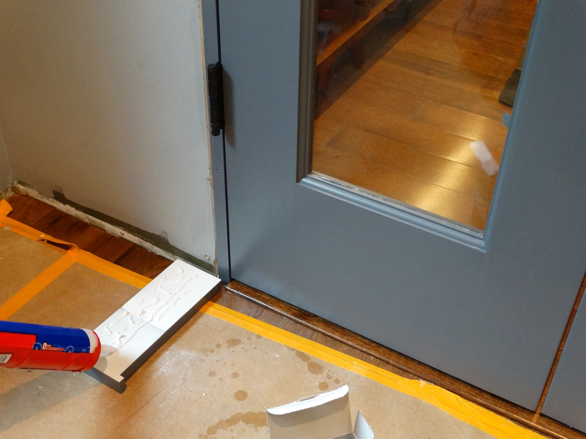 measuring trim against doorframe