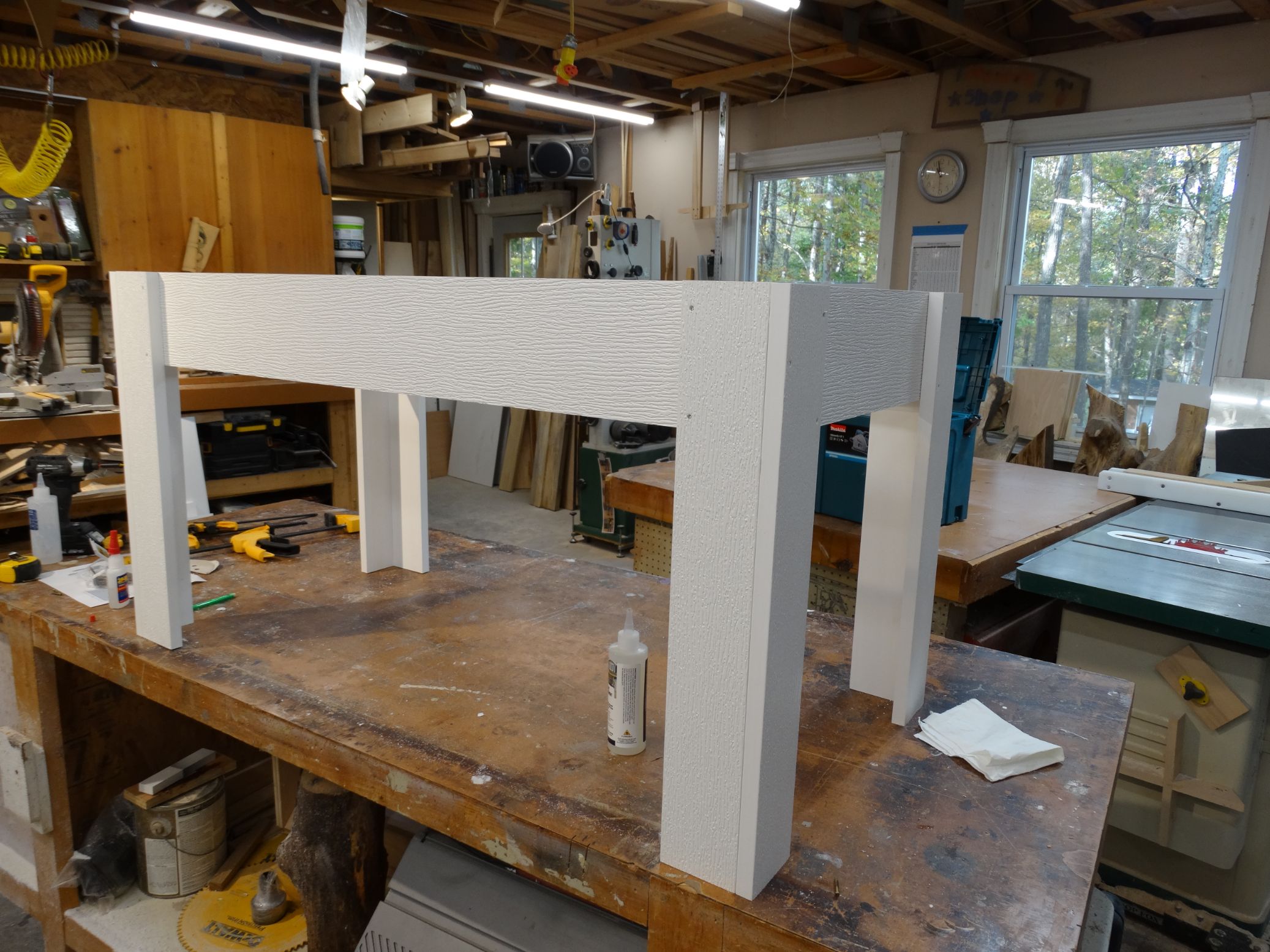 white table with legs displayed on construction table
