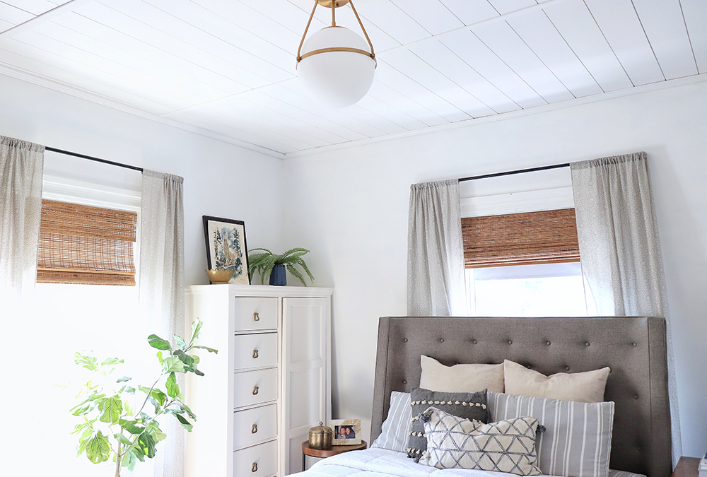 bedroom with beautiful curtains and features and a shiplap ceiling