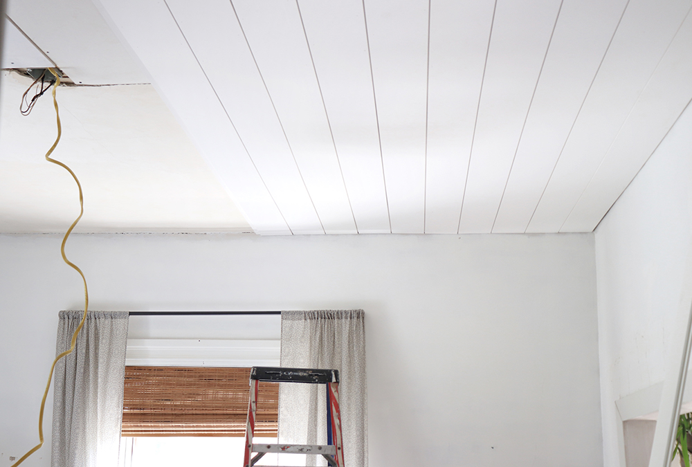 white room with natural light and shiplap ceilings